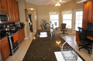 Impressive 3 Bedroom, 2 Bathroom WATERFRONT home with attached 2 on Saint Andrews South Golf Club in Florida - for sale on GolfHomes.com, golf home, golf lot
