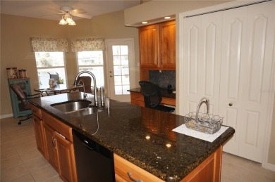 Impressive 3 Bedroom, 2 Bathroom WATERFRONT home with attached 2 on Saint Andrews South Golf Club in Florida - for sale on GolfHomes.com, golf home, golf lot