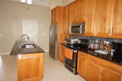 Impressive 3 Bedroom, 2 Bathroom WATERFRONT home with attached 2 on Saint Andrews South Golf Club in Florida - for sale on GolfHomes.com, golf home, golf lot