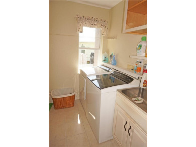 Impressive 3 Bedroom, 2 Bathroom WATERFRONT home with attached 2 on Saint Andrews South Golf Club in Florida - for sale on GolfHomes.com, golf home, golf lot