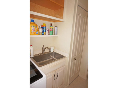 Impressive 3 Bedroom, 2 Bathroom WATERFRONT home with attached 2 on Saint Andrews South Golf Club in Florida - for sale on GolfHomes.com, golf home, golf lot