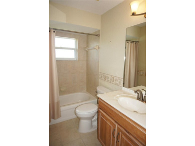 Impressive 3 Bedroom, 2 Bathroom WATERFRONT home with attached 2 on Saint Andrews South Golf Club in Florida - for sale on GolfHomes.com, golf home, golf lot