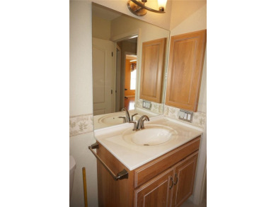 Impressive 3 Bedroom, 2 Bathroom WATERFRONT home with attached 2 on Saint Andrews South Golf Club in Florida - for sale on GolfHomes.com, golf home, golf lot