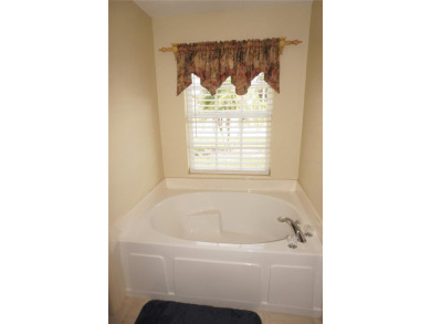 Impressive 3 Bedroom, 2 Bathroom WATERFRONT home with attached 2 on Saint Andrews South Golf Club in Florida - for sale on GolfHomes.com, golf home, golf lot