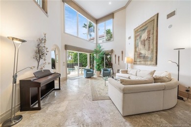 This elegant villa pool home offers 3,222 sf under air & 4,415 on Sailfish Point Golf Club, Inc. in Florida - for sale on GolfHomes.com, golf home, golf lot