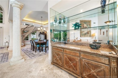 This elegant villa pool home offers 3,222 sf under air & 4,415 on Sailfish Point Golf Club, Inc. in Florida - for sale on GolfHomes.com, golf home, golf lot