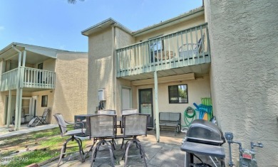 2BR/2.5BA END UNIT townhome with private back patio in a gated on Edgewater Beach Resort in Florida - for sale on GolfHomes.com, golf home, golf lot