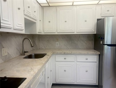 Experience spacious living in this 1BR/1.5BA condo in Palm Aire on Palm-Aire Country Club and Resort - Palms in Florida - for sale on GolfHomes.com, golf home, golf lot