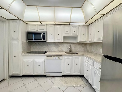 Experience spacious living in this 1BR/1.5BA condo in Palm Aire on Palm-Aire Country Club and Resort - Palms in Florida - for sale on GolfHomes.com, golf home, golf lot