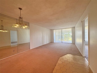 Experience spacious living in this 1BR/1.5BA condo in Palm Aire on Palm-Aire Country Club and Resort - Palms in Florida - for sale on GolfHomes.com, golf home, golf lot