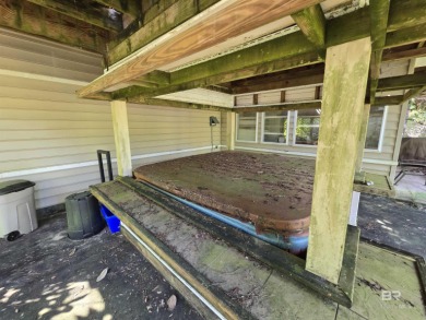 Unlock the potential of this lake home on highly sought-after on Lake Forest Yacht and Country Club in Alabama - for sale on GolfHomes.com, golf home, golf lot