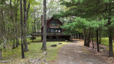 Tucked at the end of a quiet cul-de-sac and overlooking a on Paupack Hills Golf and Country Club in Pennsylvania - for sale on GolfHomes.com, golf home, golf lot
