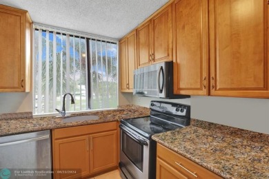 Spacious 2 bed, 2 bath condo with a private balcony and golf on Inverrary Country Club in Florida - for sale on GolfHomes.com, golf home, golf lot