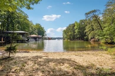 Experience lakefront living in this stunning 4-bedroom, 3.5-bath on The Palisades Country Club in North Carolina - for sale on GolfHomes.com, golf home, golf lot