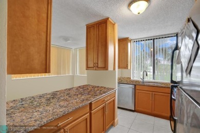 Spacious 2 bed, 2 bath condo with a private balcony and golf on Inverrary Country Club in Florida - for sale on GolfHomes.com, golf home, golf lot