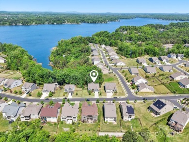 Experience lakefront living in this stunning 4-bedroom, 3.5-bath on The Palisades Country Club in North Carolina - for sale on GolfHomes.com, golf home, golf lot