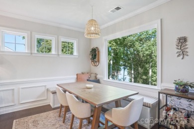 Experience lakefront living in this stunning 4-bedroom, 3.5-bath on The Palisades Country Club in North Carolina - for sale on GolfHomes.com, golf home, golf lot