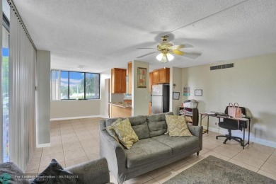 Spacious 2 bed, 2 bath condo with a private balcony and golf on Inverrary Country Club in Florida - for sale on GolfHomes.com, golf home, golf lot