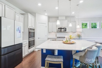 Experience lakefront living in this stunning 4-bedroom, 3.5-bath on The Palisades Country Club in North Carolina - for sale on GolfHomes.com, golf home, golf lot