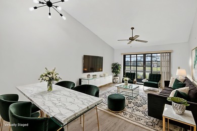 Enjoy stunning lake and golf course views right from your living on Heritage Ridge Golf Club in Florida - for sale on GolfHomes.com, golf home, golf lot