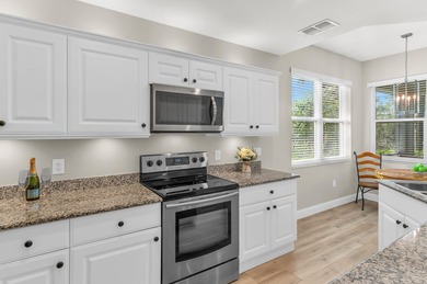 Welcome to this elegant, end unit, first-floor condo located in on Silver Lakes Resort and Golf Club in Florida - for sale on GolfHomes.com, golf home, golf lot