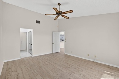 Enjoy stunning lake and golf course views right from your living on Heritage Ridge Golf Club in Florida - for sale on GolfHomes.com, golf home, golf lot