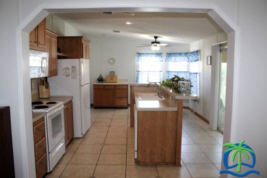 **Charming Waterfront Retreat in Florida!** NEW ROOF 2025! on Cypresswood Golf and Country Club in Florida - for sale on GolfHomes.com, golf home, golf lot