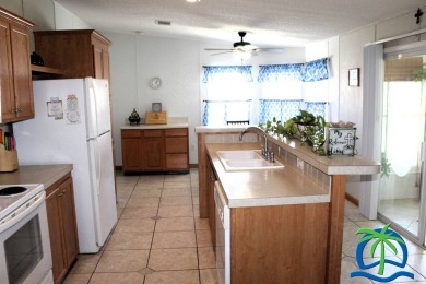 **Charming Waterfront Retreat in Florida!** NEW ROOF 2025! on Cypresswood Golf and Country Club in Florida - for sale on GolfHomes.com, golf home, golf lot