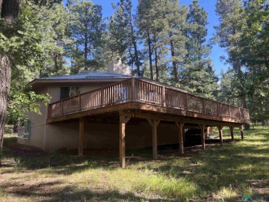 Take a look at this unique octagon home with easy year round on Pendaries Village Community Assoc. in New Mexico - for sale on GolfHomes.com, golf home, golf lot