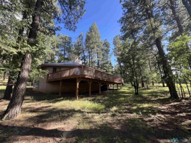 Take a look at this unique octagon home with easy year round on Pendaries Village Community Assoc. in New Mexico - for sale on GolfHomes.com, golf home, golf lot