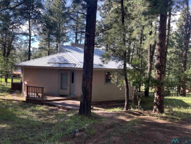Take a look at this unique octagon home with easy year round on Pendaries Village Community Assoc. in New Mexico - for sale on GolfHomes.com, golf home, golf lot