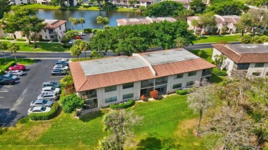 Nestled in a picturesque gated community, this magnificent on Boca Lago Golf and Country Club in Florida - for sale on GolfHomes.com, golf home, golf lot