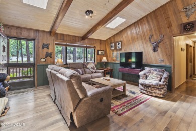 Charming single-level cabin in Pinetop Country Club, offering 1 on Pinetop Lakes Country Club in Arizona - for sale on GolfHomes.com, golf home, golf lot