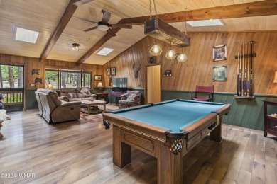 Charming single-level cabin in Pinetop Country Club, offering 1 on Pinetop Lakes Country Club in Arizona - for sale on GolfHomes.com, golf home, golf lot