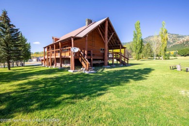 This beautiful log home combines rustic charm with modern on Star Valley RV Golf Course in Wyoming - for sale on GolfHomes.com, golf home, golf lot