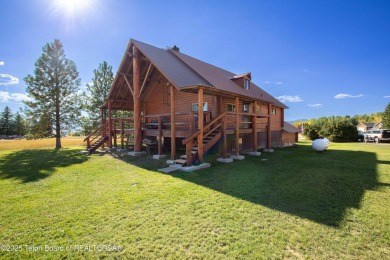This beautiful log home combines rustic charm with modern on Star Valley RV Golf Course in Wyoming - for sale on GolfHomes.com, golf home, golf lot