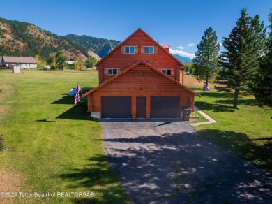 This beautiful log home combines rustic charm with modern on Star Valley RV Golf Course in Wyoming - for sale on GolfHomes.com, golf home, golf lot