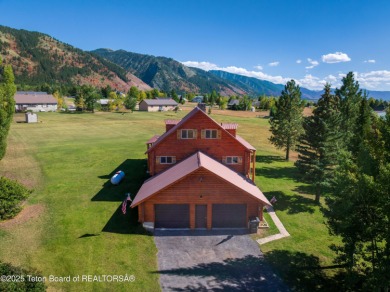This beautiful log home combines rustic charm with modern on Star Valley RV Golf Course in Wyoming - for sale on GolfHomes.com, golf home, golf lot