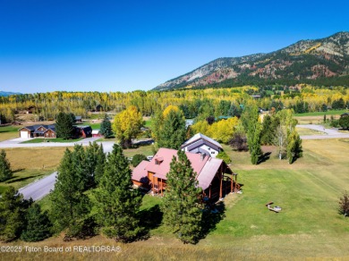 This beautiful log home combines rustic charm with modern on Star Valley RV Golf Course in Wyoming - for sale on GolfHomes.com, golf home, golf lot