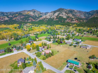 This beautiful log home combines rustic charm with modern on Star Valley RV Golf Course in Wyoming - for sale on GolfHomes.com, golf home, golf lot