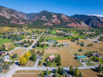 This beautiful log home combines rustic charm with modern on Star Valley RV Golf Course in Wyoming - for sale on GolfHomes.com, golf home, golf lot