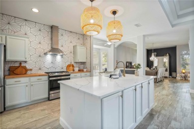 PRICE REDUCTION! BRAND NEW ROOF AND PLETHORA OF UPGRADES! This on University Park Country Club in Florida - for sale on GolfHomes.com, golf home, golf lot