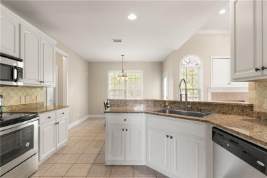 Discover this stunning traditional-style home located in the on Oak Grove Island Golf and Country Club in Georgia - for sale on GolfHomes.com, golf home, golf lot