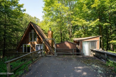 Classic Pocono Lake chalet with endless potential! This on The Hideout Golf in Pennsylvania - for sale on GolfHomes.com, golf home, golf lot