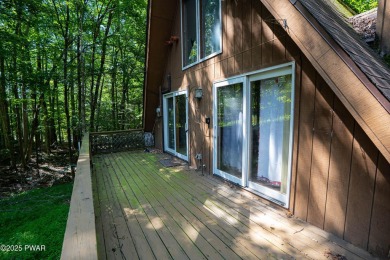 Classic Pocono Lake chalet with endless potential! This on The Hideout Golf in Pennsylvania - for sale on GolfHomes.com, golf home, golf lot