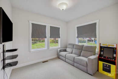 This stunning, custom-built home features both a primary and on Hunters Point Golf Club in Idaho - for sale on GolfHomes.com, golf home, golf lot
