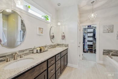This stunning, custom-built home features both a primary and on Hunters Point Golf Club in Idaho - for sale on GolfHomes.com, golf home, golf lot