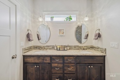 This stunning, custom-built home features both a primary and on Hunters Point Golf Club in Idaho - for sale on GolfHomes.com, golf home, golf lot