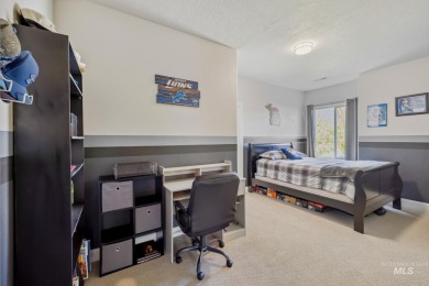 This stunning, custom-built home features both a primary and on Hunters Point Golf Club in Idaho - for sale on GolfHomes.com, golf home, golf lot