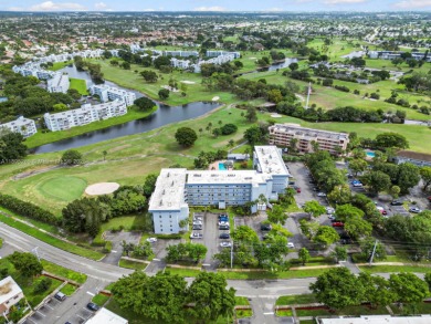 Welcome to a stunning corner Unit 2 bedrooms and 2 bathrooms on Oriole Golf and Tennis Club in Florida - for sale on GolfHomes.com, golf home, golf lot